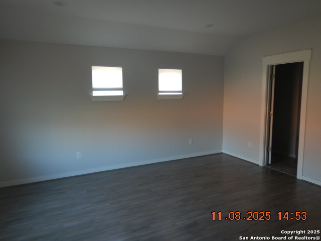 10639 Francisco Way Converse, TX 78109 - Photo 5 of 16 a view of an empty room with wooden floor and a window