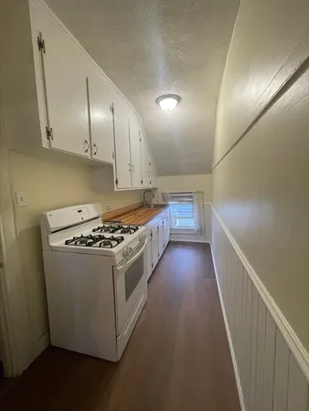 a kitchen with a stove and a refrigerator