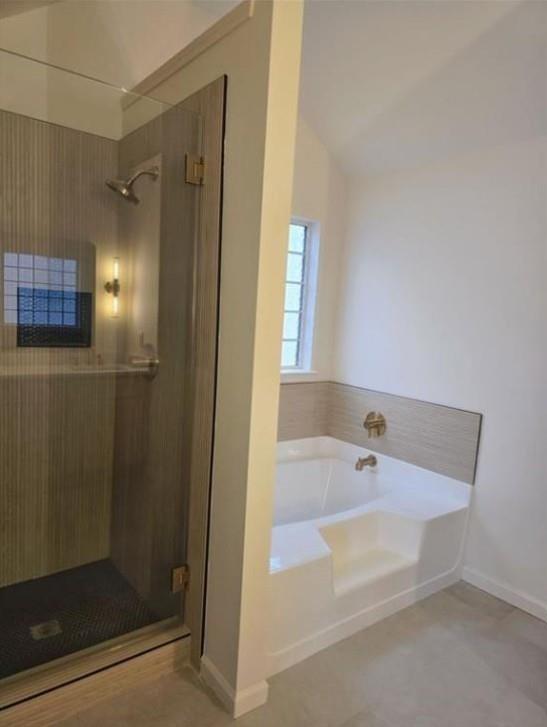 4095 Arch Pass Cumming, GA 30040 - Photo 27 of 31 a bathroom with a bathtub and a shower