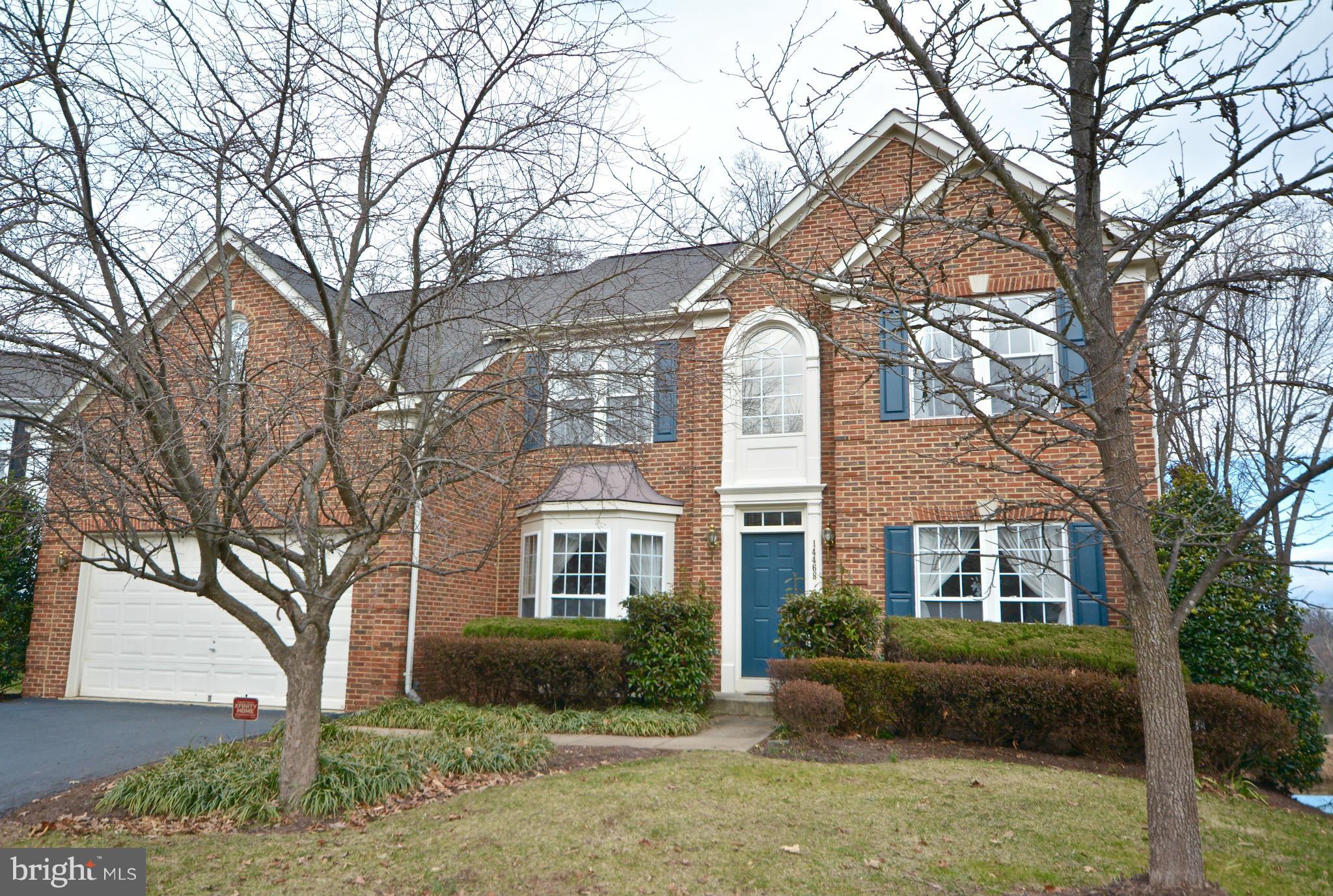 14468 Clubhouse Road Gainesville, VA 20155 - Photo 1 of 30 a front view of a house with a yard