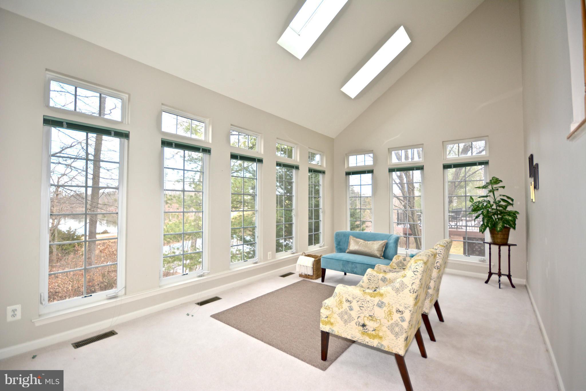 14468 Clubhouse Road Gainesville, VA 20155 - Photo 13 of 30 a living room with furniture and floor to ceiling windows