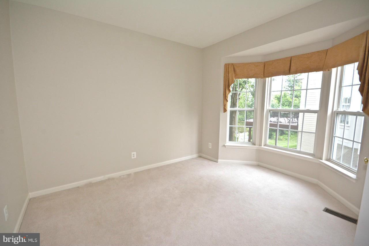 14468 Clubhouse Road Gainesville, VA 20155 - Photo 14 of 30 a view of an empty room with a window