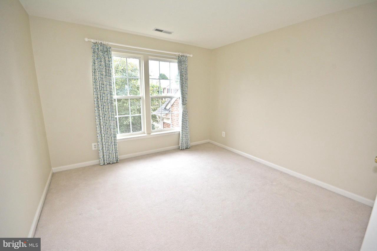 14468 Clubhouse Road Gainesville, VA 20155 - Photo 19 of 30 an empty room with windows