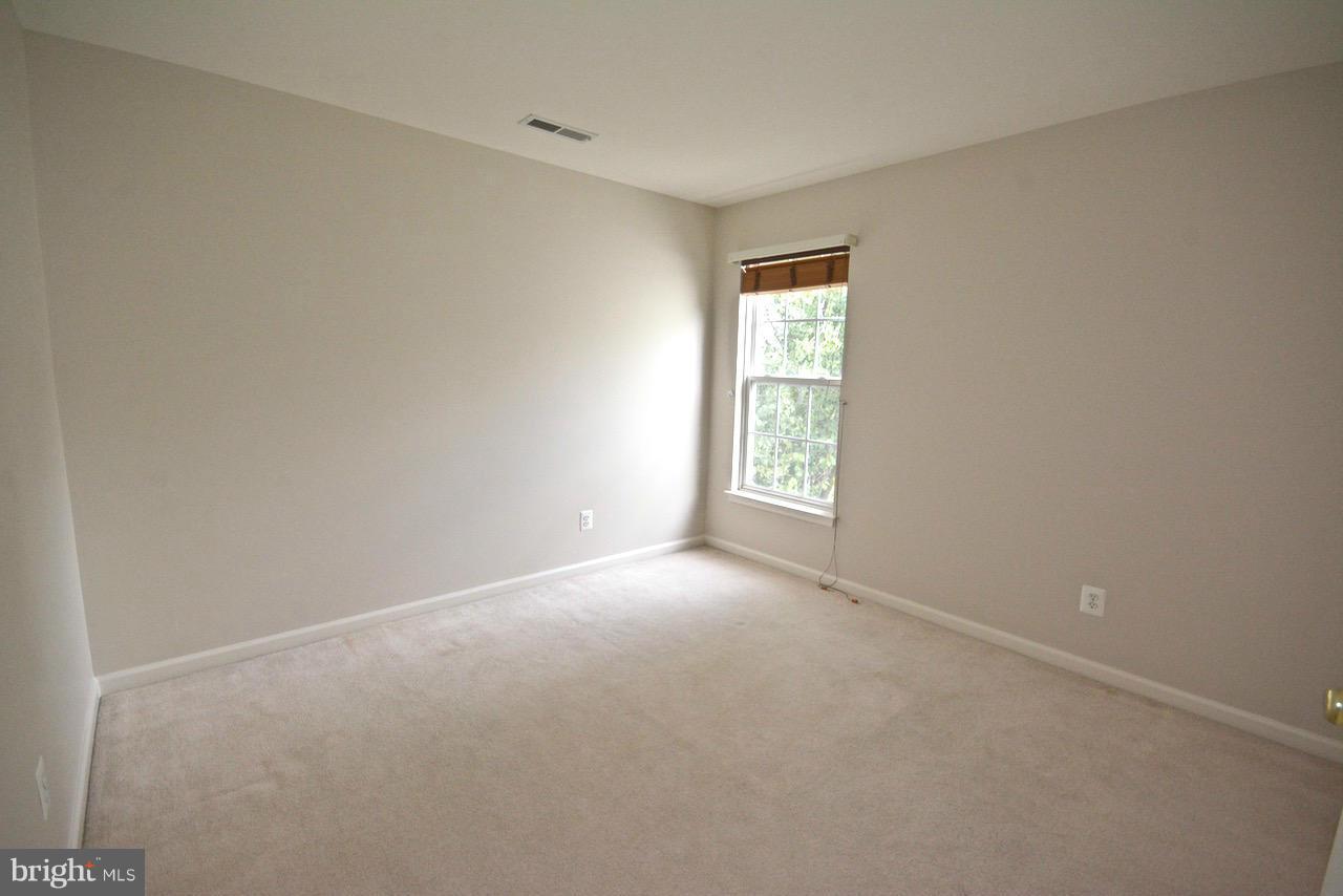 14468 Clubhouse Road Gainesville, VA 20155 - Photo 20 of 30 a view of an empty room with a window