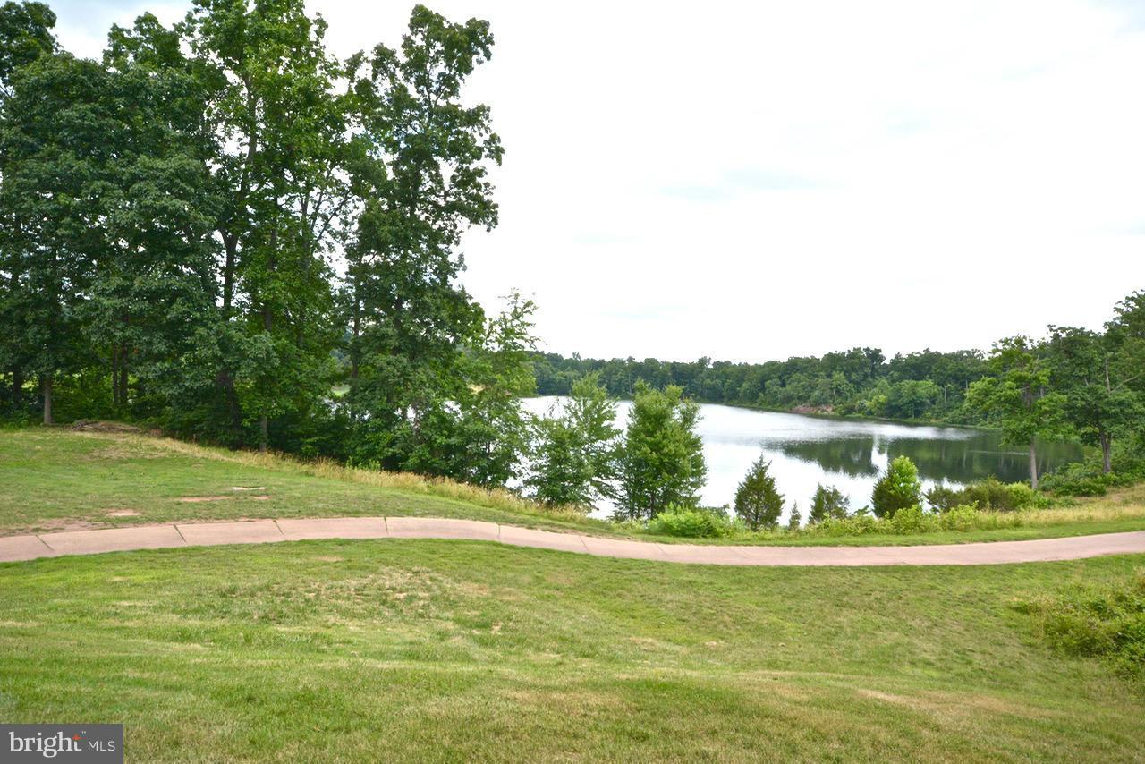 14468 Clubhouse Road Gainesville, VA 20155 - Photo 3 of 30 a view of a lake from a yard
