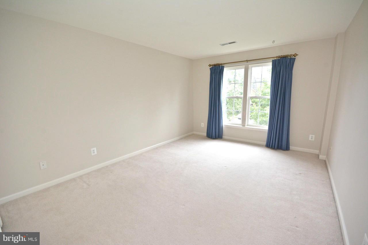 14468 Clubhouse Road Gainesville, VA 20155 - Photo 21 of 30 a view of an empty room with a window