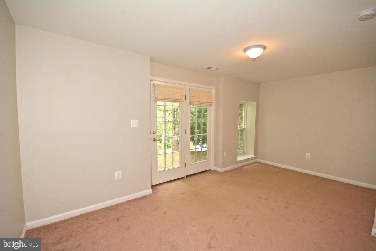 14468 Clubhouse Road Gainesville, VA 20155 - Photo 23 of 30 an empty room with windows