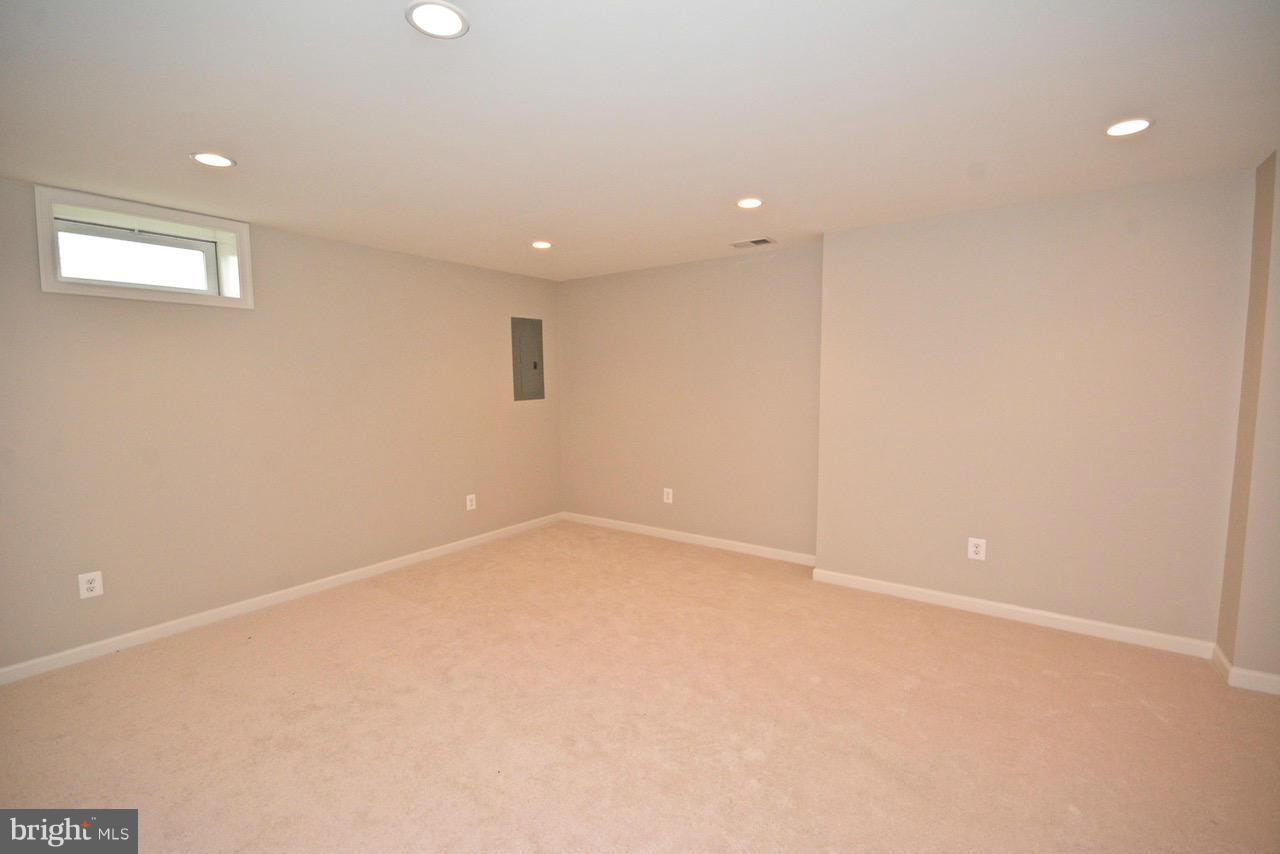 14468 Clubhouse Road Gainesville, VA 20155 - Photo 26 of 30 an empty room with a empty space and windows