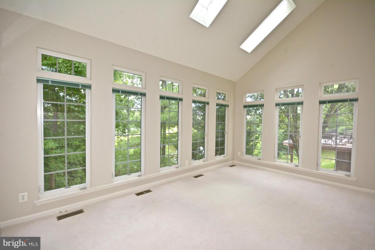 14468 Clubhouse Road Gainesville, VA 20155 - Photo 28 of 30 a view of an empty room with windows and balcony