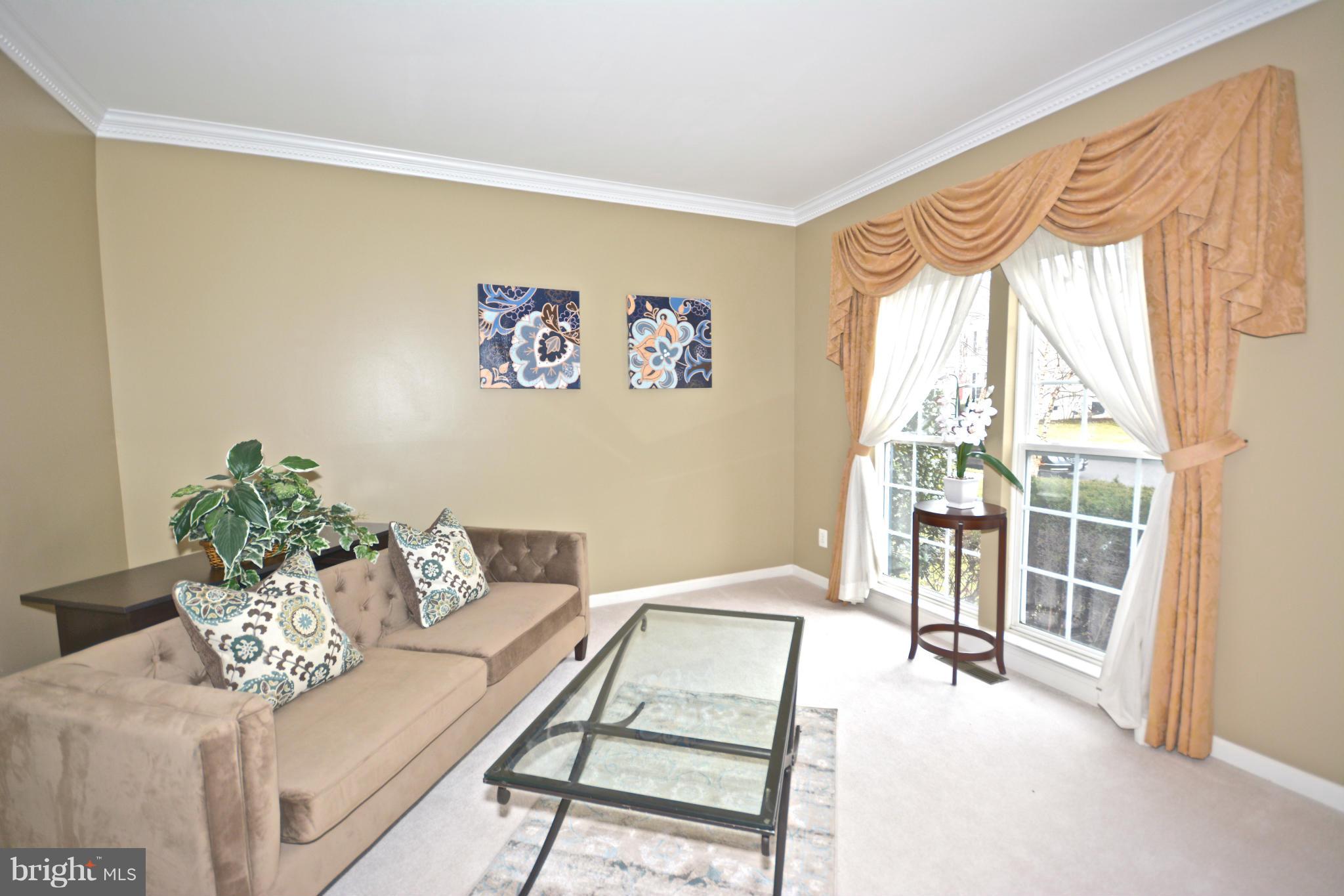 14468 Clubhouse Road Gainesville, VA 20155 - Photo 4 of 30 a living room with furniture and a window