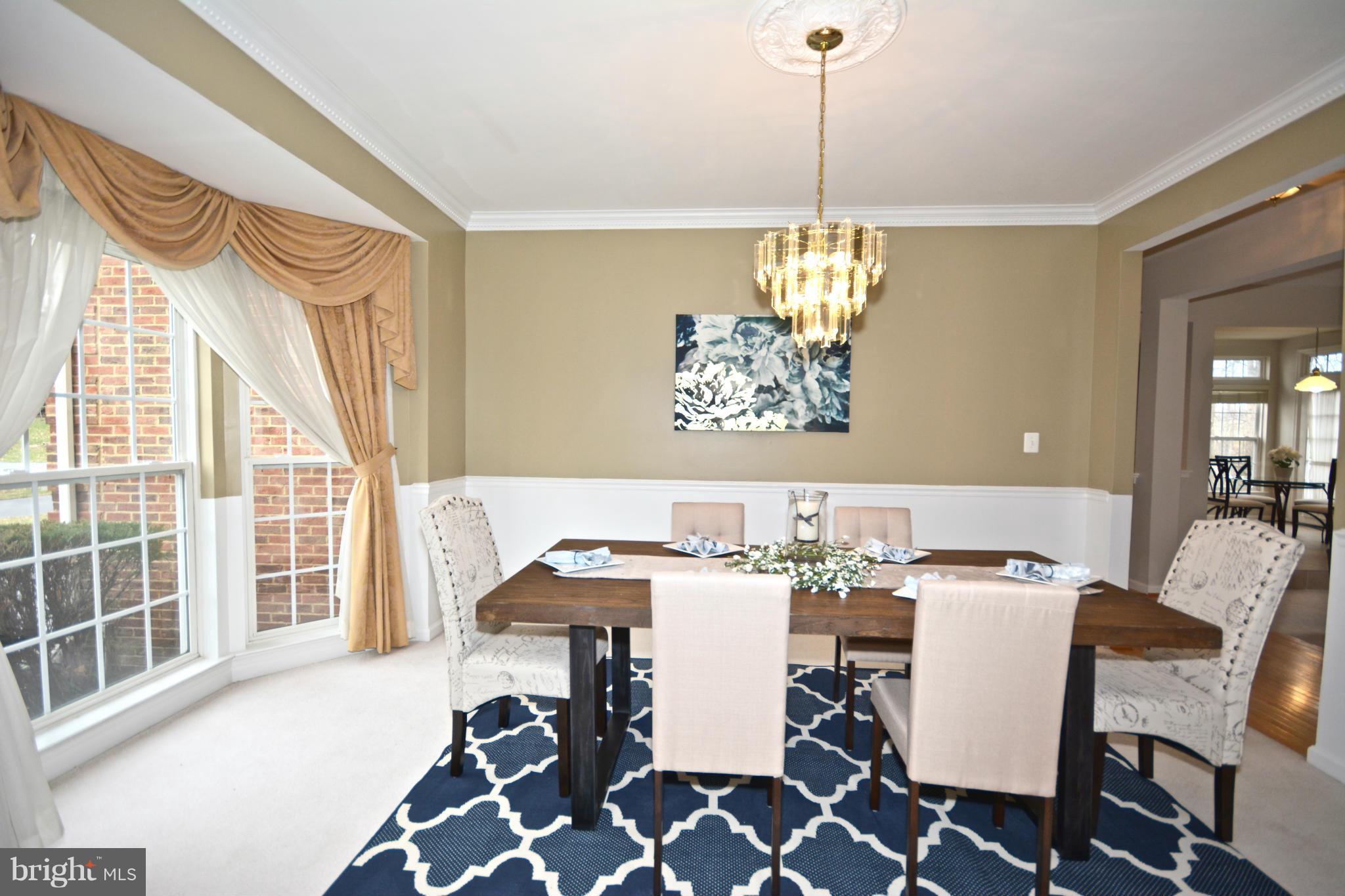 14468 Clubhouse Road Gainesville, VA 20155 - Photo 5 of 30 a view of a dining room with furniture window and outside view