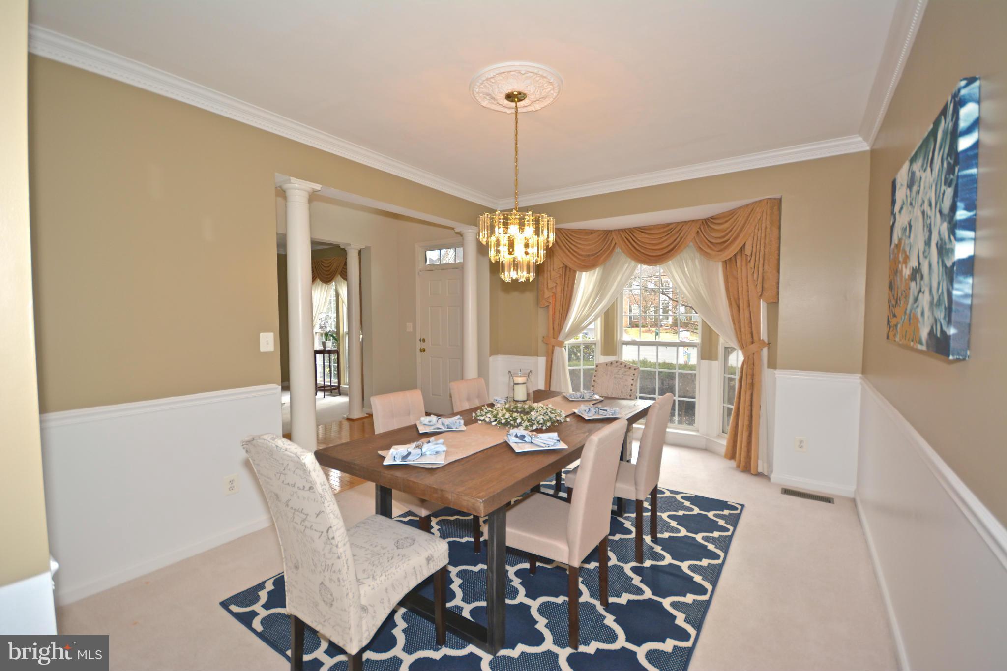 14468 Clubhouse Road Gainesville, VA 20155 - Photo 6 of 30 a view of a dining room with furniture window and wooden floor