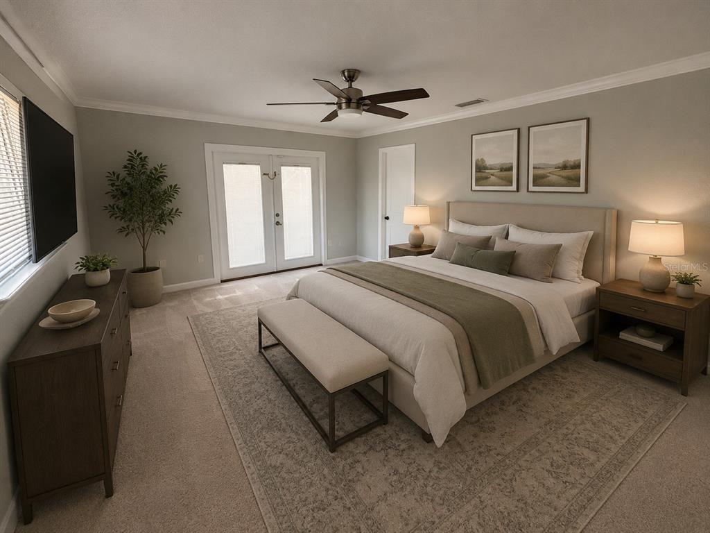 9801 Southeast Sunset Harbor Road Summerfield, FL 34491 - Photo 8 of 37 a spacious bedroom with a bed and a chandelier
