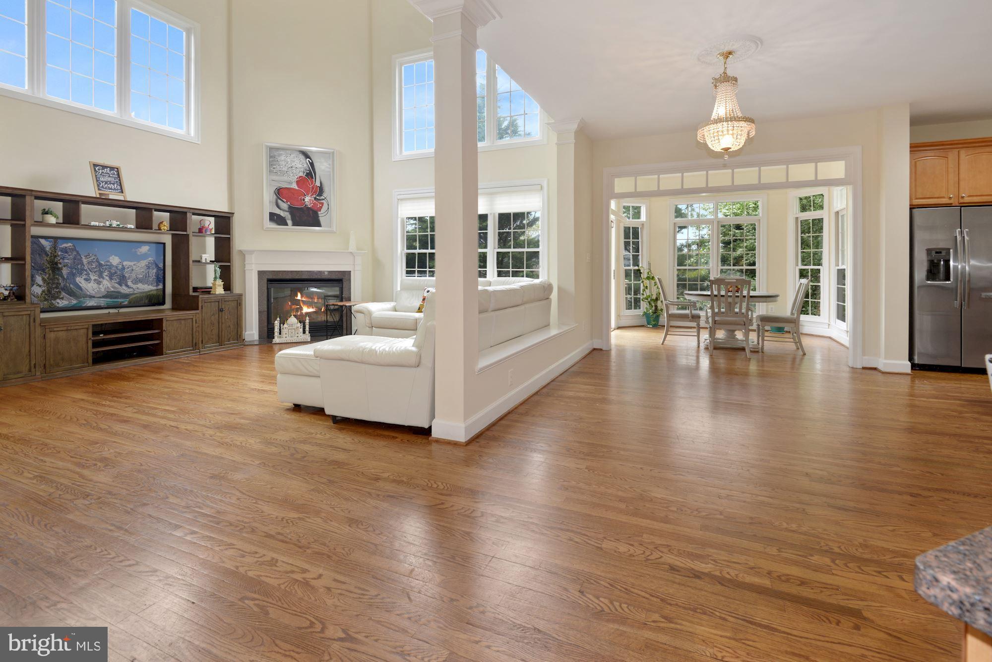 1406 Stanbridge Place Vienna, VA 22182 - Photo 3 of 48 Open family room to kitchen! 18 ft ceilings!