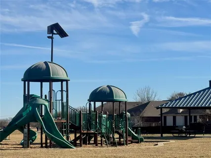 a view of a house with backyard porch and furniture