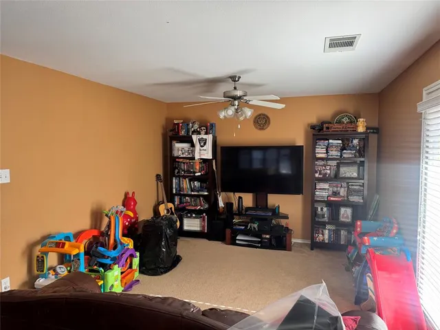 a bathroom with a sink a bathtub and a chandelier