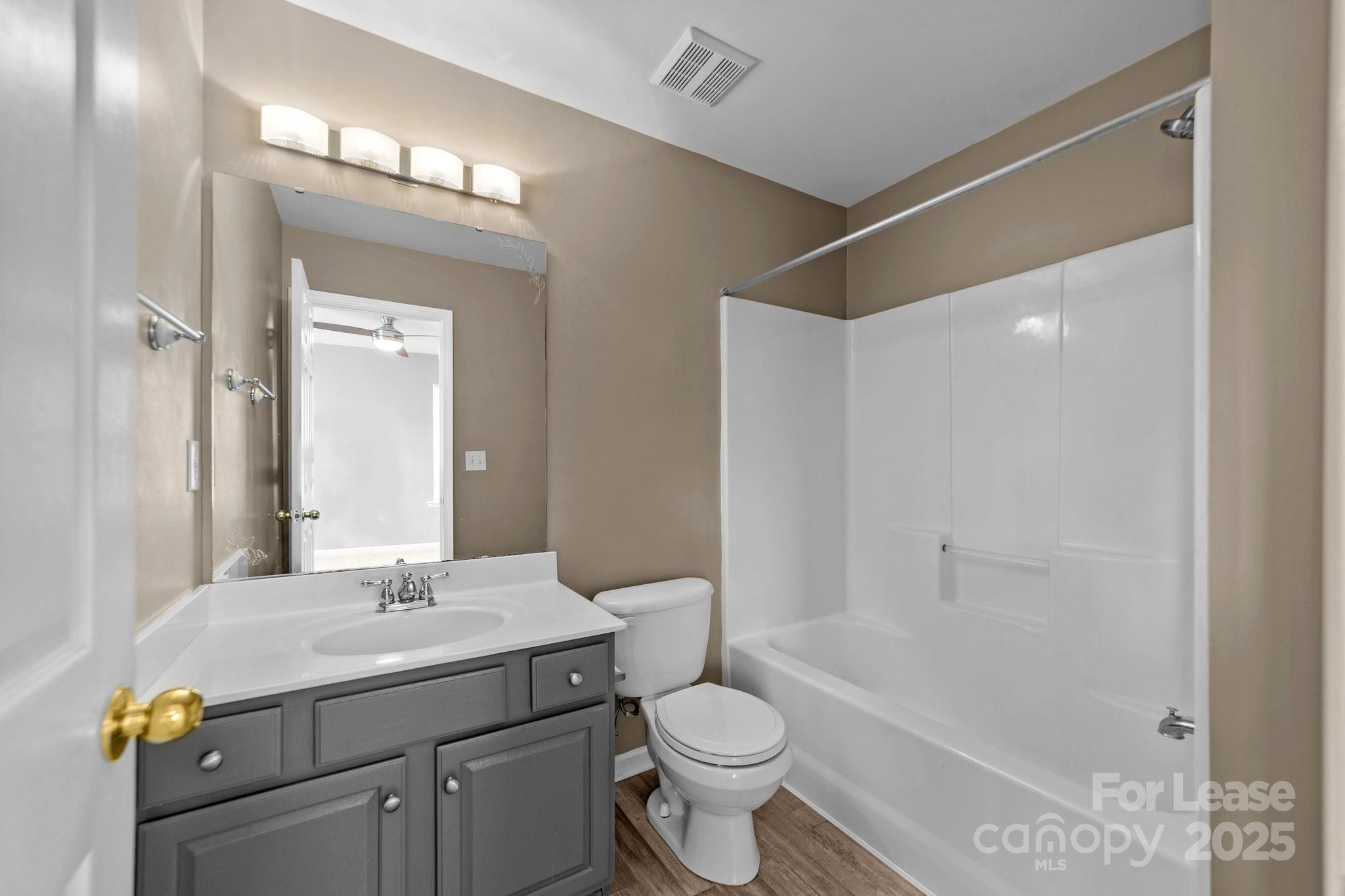 17562 Caldwell Track Drive Cornelius, NC 28031 - Photo 21 of 38 a bathroom with a sink a toilet and shower