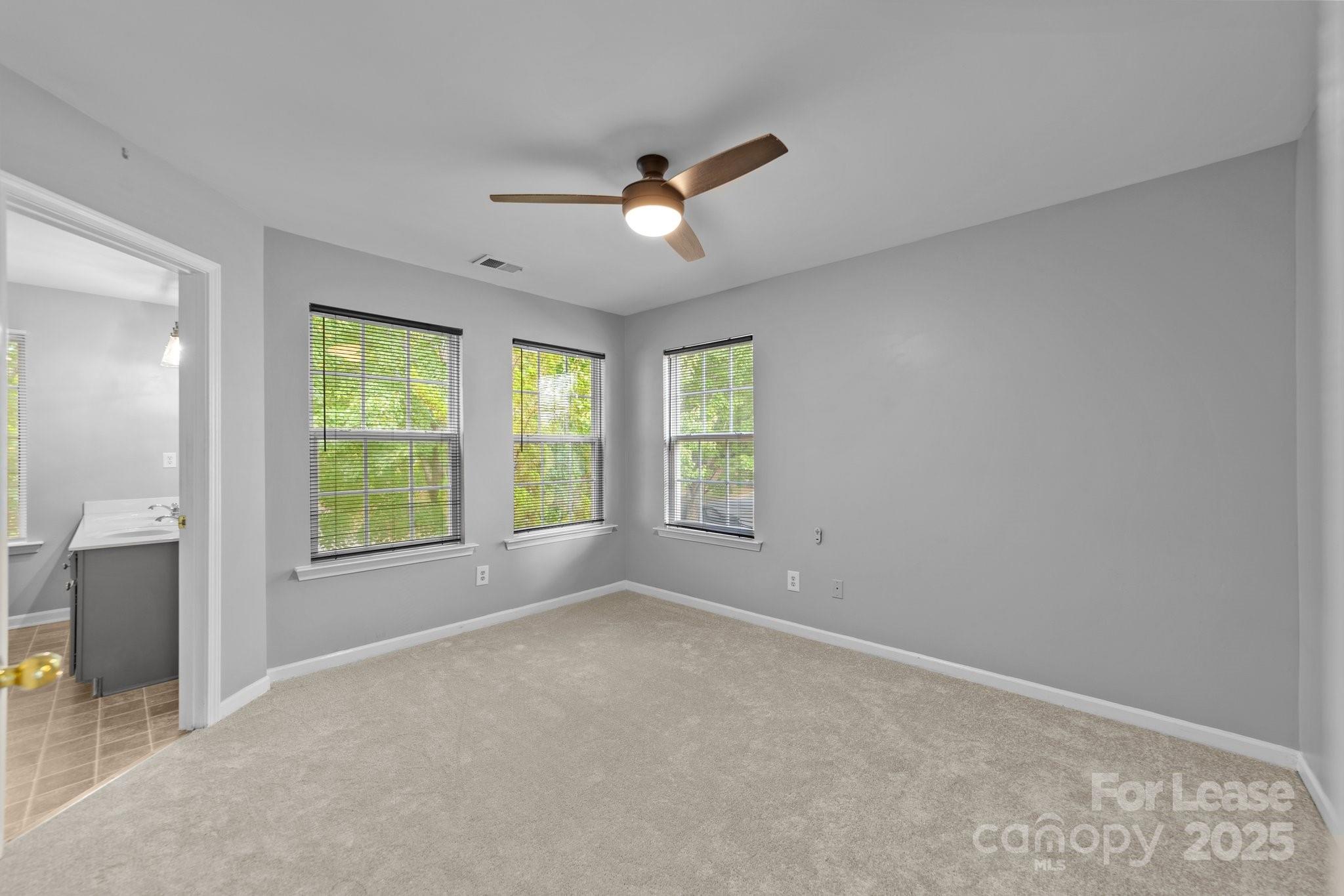 17562 Caldwell Track Drive Cornelius, NC 28031 - Photo 23 of 38 wooden floor in an empty room with a window