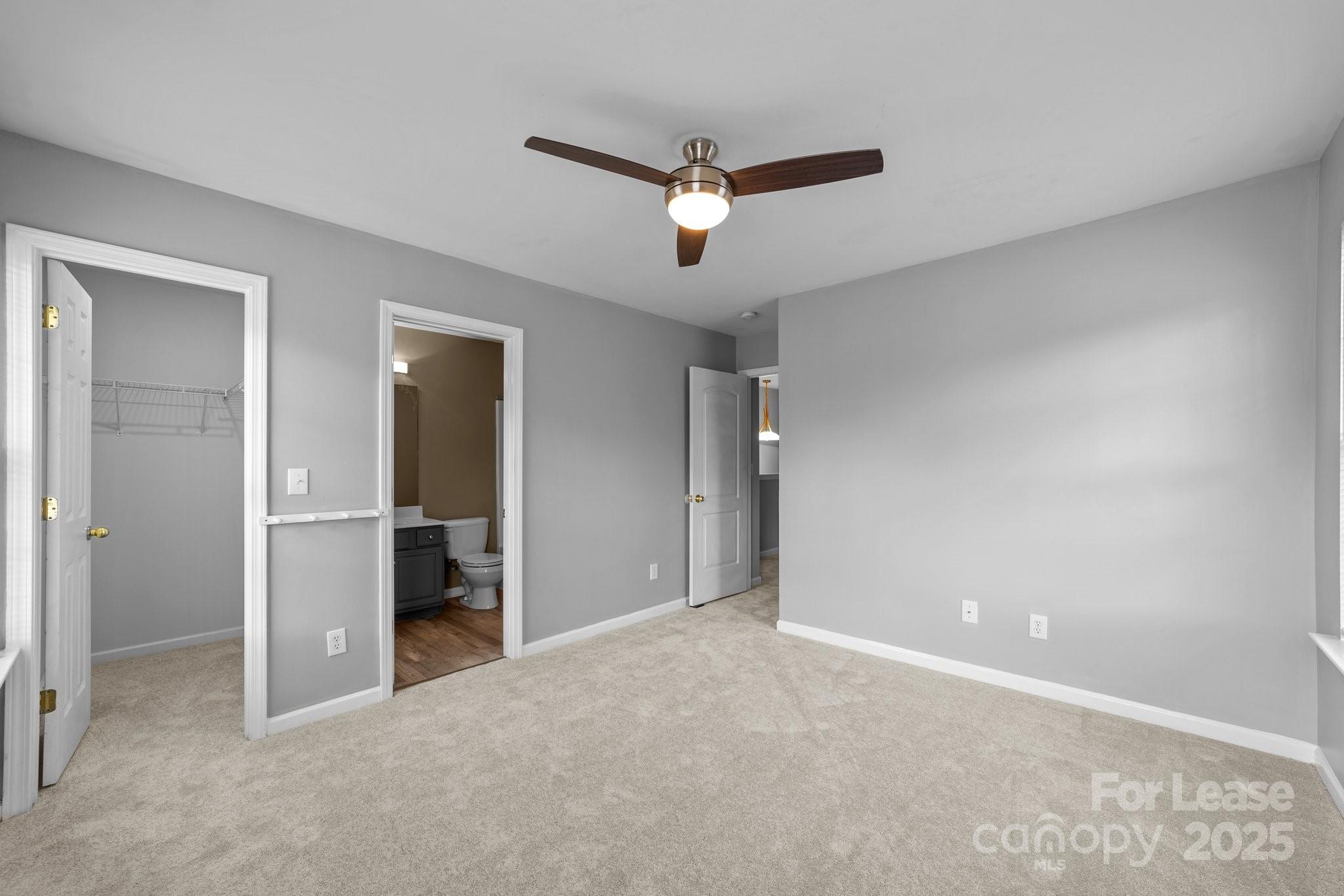 17562 Caldwell Track Drive Cornelius, NC 28031 - Photo 30 of 38 a view of a livingroom with a ceiling fan