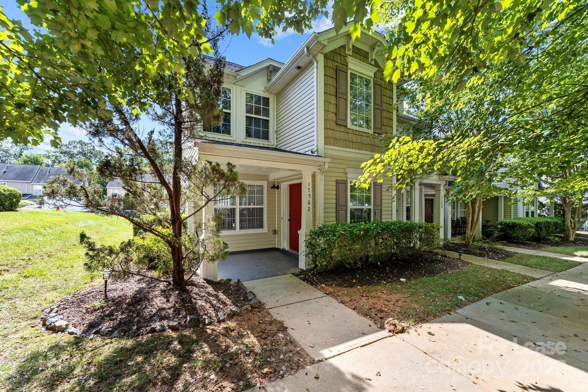 17562 Caldwell Track Drive Cornelius, NC 28031 - Photo 33 of 38 a front view of a house with garden