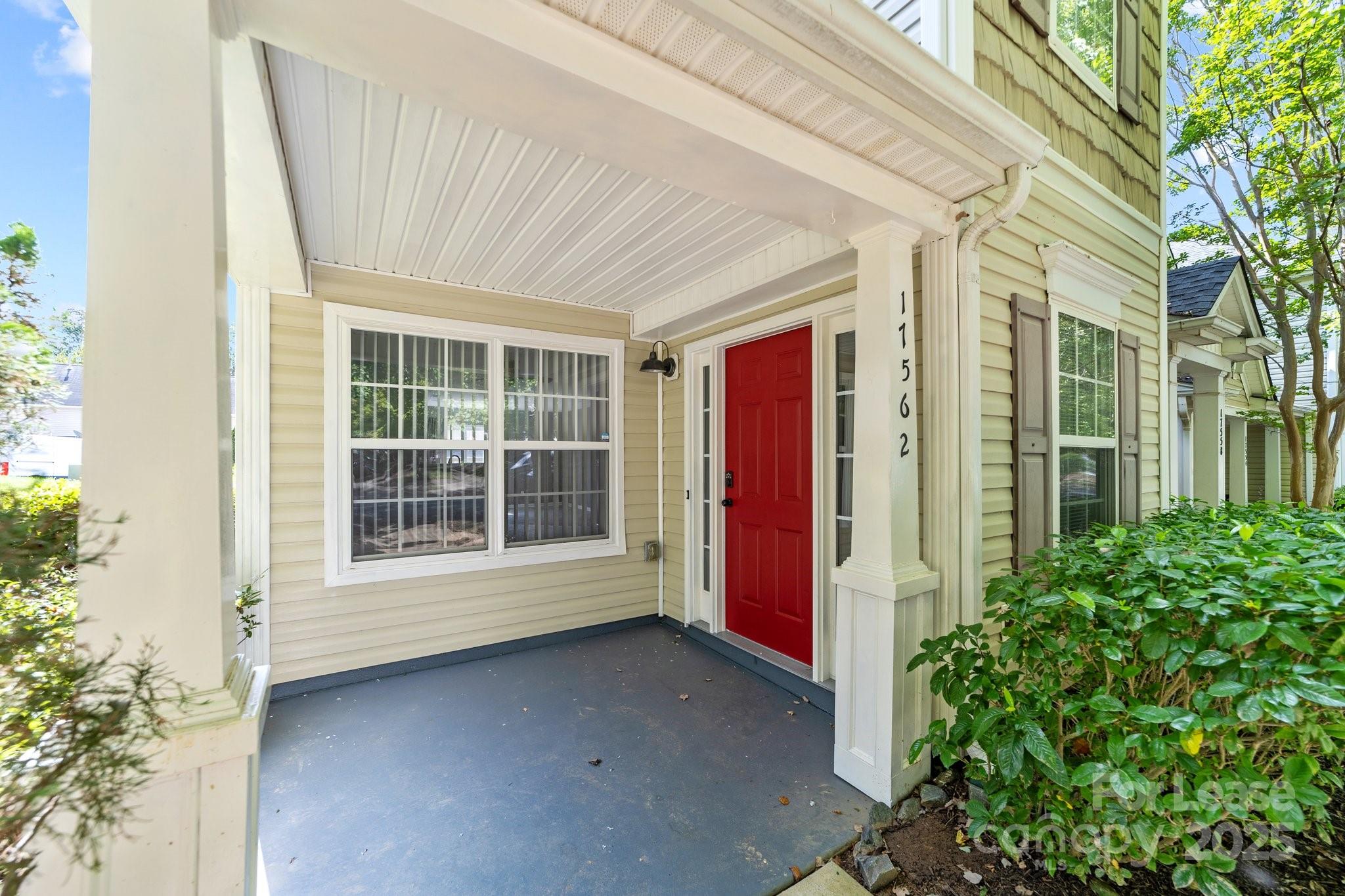 17562 Caldwell Track Drive Cornelius, NC 28031 - Photo 34 of 38 a view of a house with a large window and yard