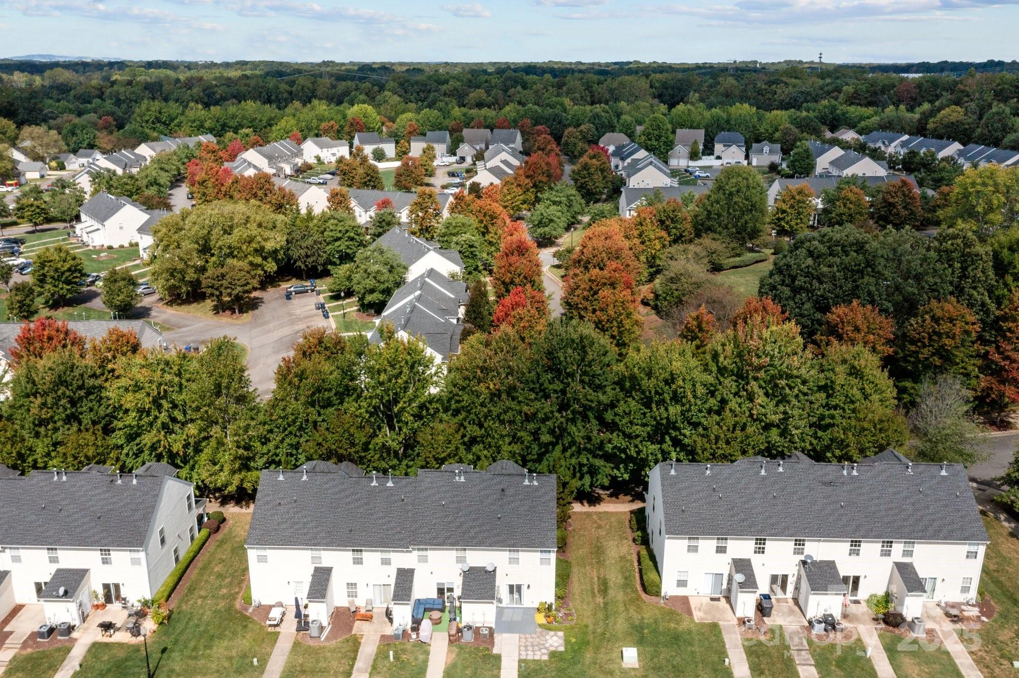 17562 Caldwell Track Drive Cornelius, NC 28031 - Photo 37 of 38 an aerial view of residential houses with outdoor space and trees