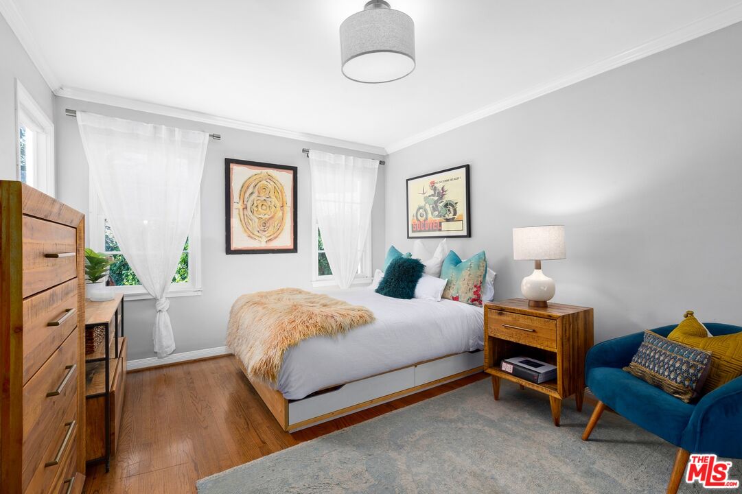 2300 Gardner Place Glendale, CA 91206 - Photo 12 of 20 a bedroom with a bed and wooden floor