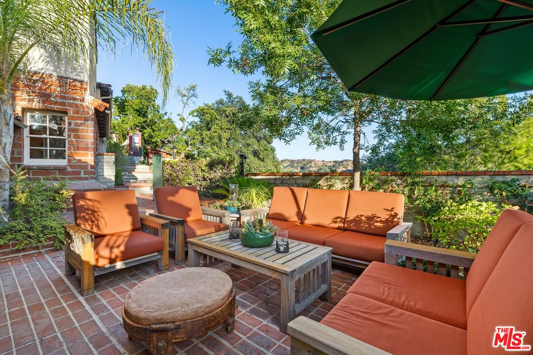 2300 Gardner Place Glendale, CA 91206 - Photo 14 of 20 a backyard of a house with barbeque oven table and chairs