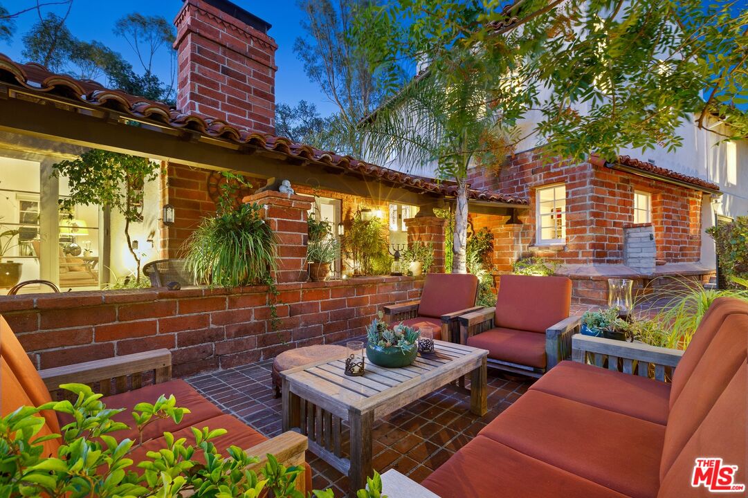 2300 Gardner Place Glendale, CA 91206 - Photo 18 of 20 a view of a patio with couches table and chairs and potted plants