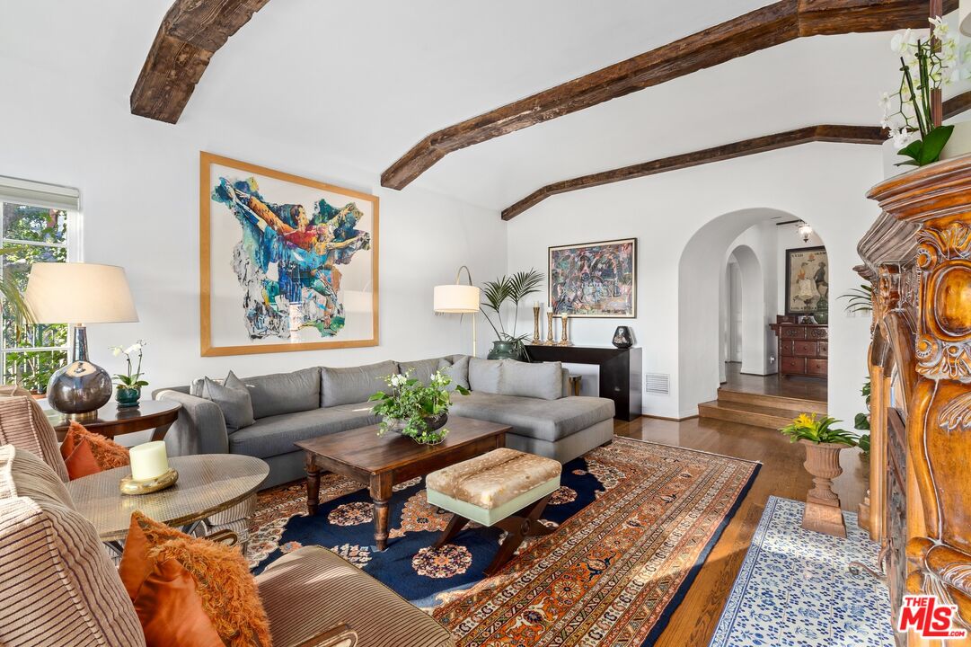 2300 Gardner Place Glendale, CA 91206 - Photo 4 of 20 a living room with furniture a rug and a wall painting