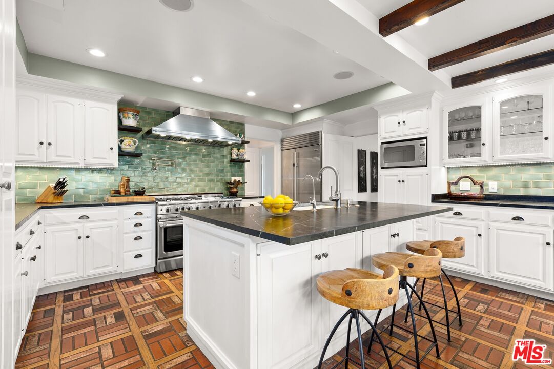2300 Gardner Place Glendale, CA 91206 - Photo 6 of 20 a kitchen with granite countertop a sink and cabinets