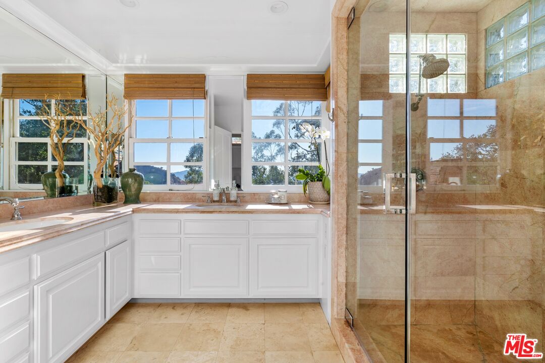 2300 Gardner Place Glendale, CA 91206 - Photo 10 of 20 a bathroom with a tub sink and mirror
