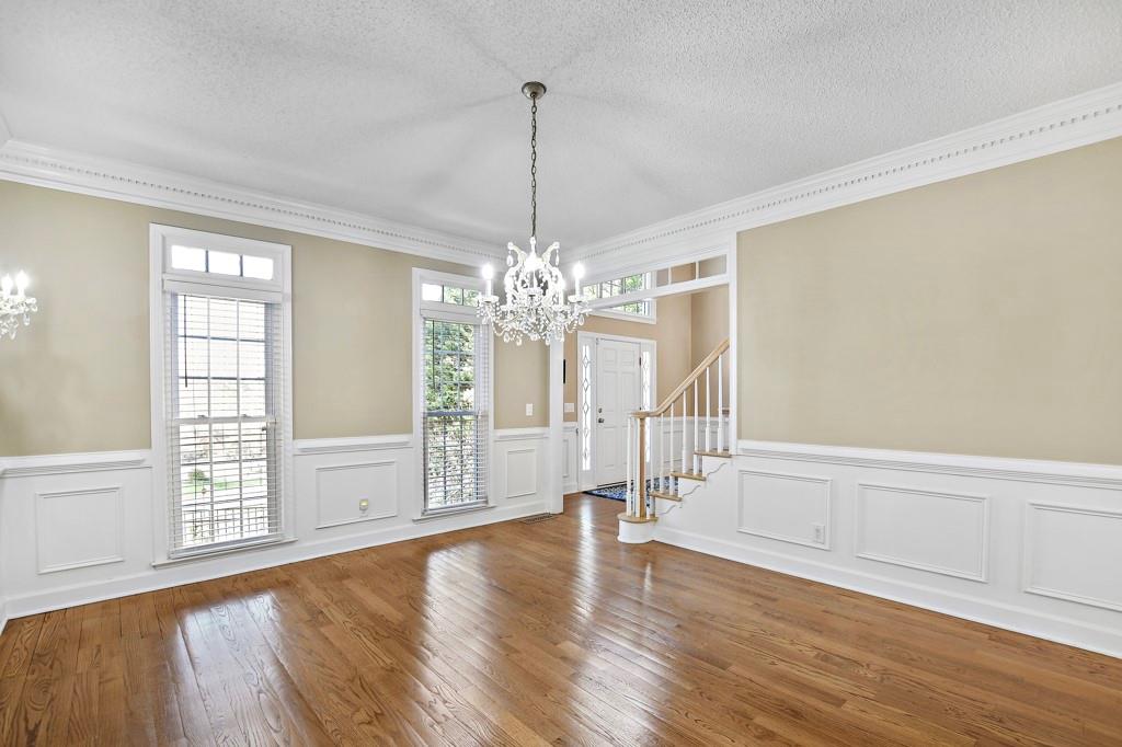 4409 Windsor Oaks Circle Marietta, GA 30066 - Photo 20 of 90 a view of an empty room with wooden floor and a window