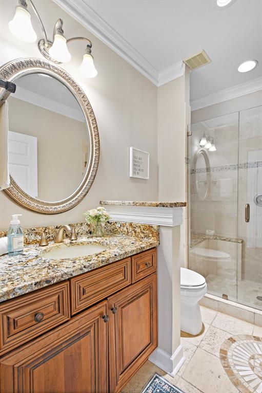 4409 Windsor Oaks Circle Marietta, GA 30066 - Photo 23 of 90 a bathroom with a granite countertop toilet a mirror and a shower