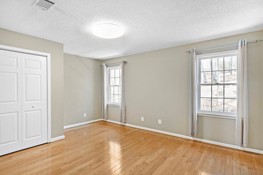 4409 Windsor Oaks Circle Marietta, GA 30066 - Photo 39 of 90 an empty room with wooden floor and windows