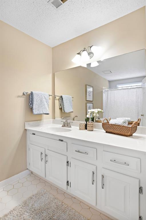 4409 Windsor Oaks Circle Marietta, GA 30066 - Photo 41 of 90 a bathroom with a sink vanity and mirror
