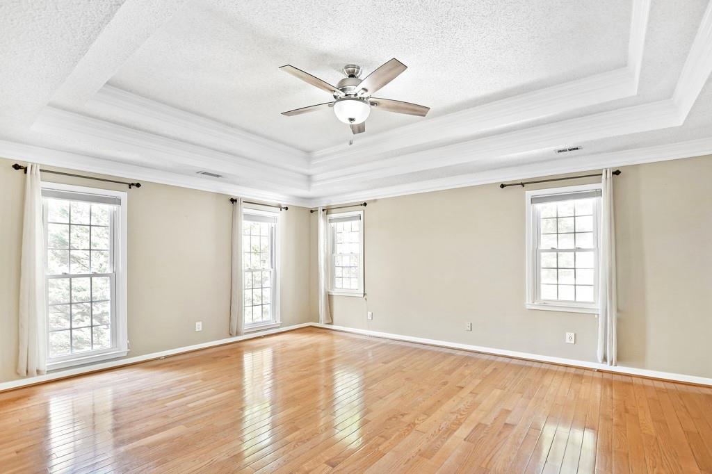 4409 Windsor Oaks Circle Marietta, GA 30066 - Photo 44 of 90 a view of an empty room with wooden floor and a window