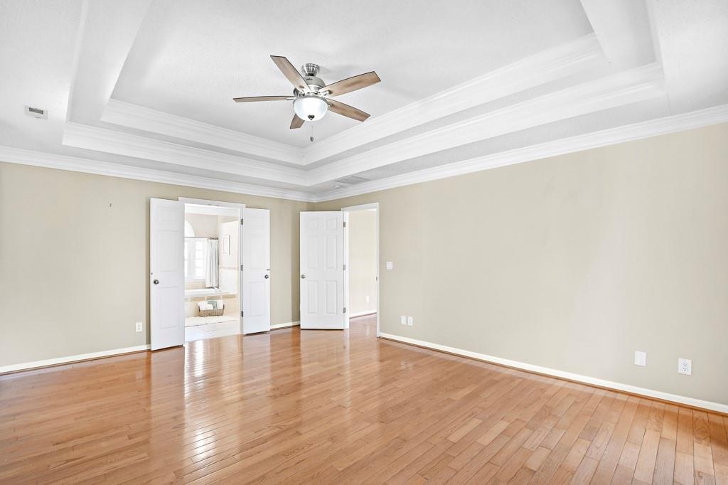 4409 Windsor Oaks Circle Marietta, GA 30066 - Photo 45 of 90 a view of an empty room with wooden floor and a window