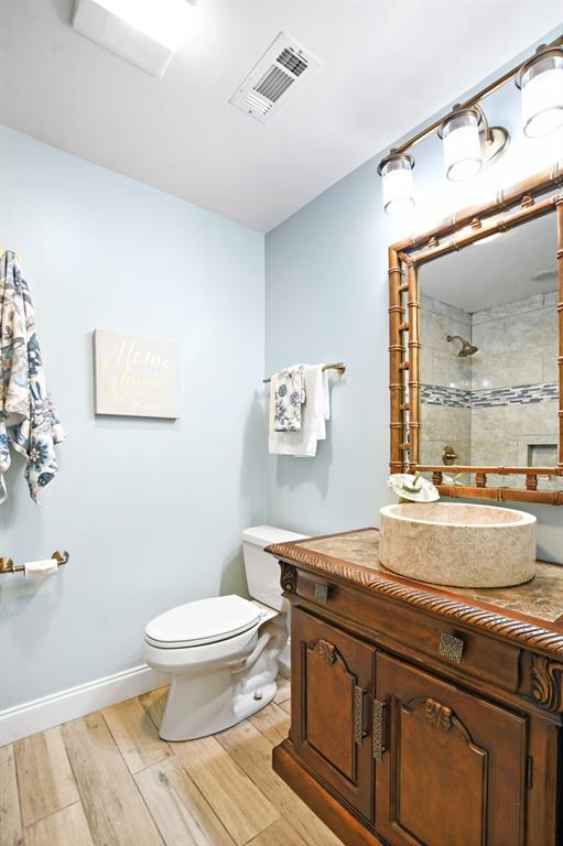 4409 Windsor Oaks Circle Marietta, GA 30066 - Photo 54 of 90 a bathroom with a sink a toilet and a mirror