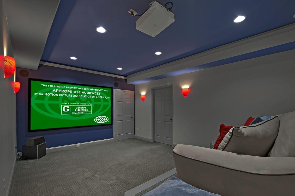 4409 Windsor Oaks Circle Marietta, GA 30066 - Photo 59 of 90 a living room with a projector and a projector screen