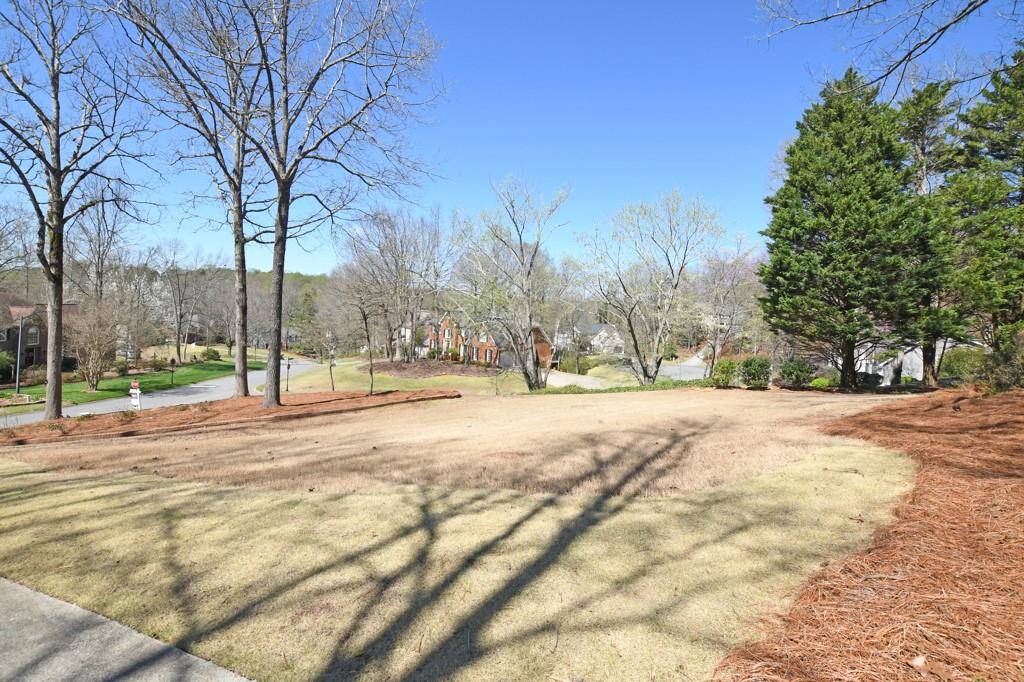 4409 Windsor Oaks Circle Marietta, GA 30066 - Photo 79 of 90 a view of road with a house in the background