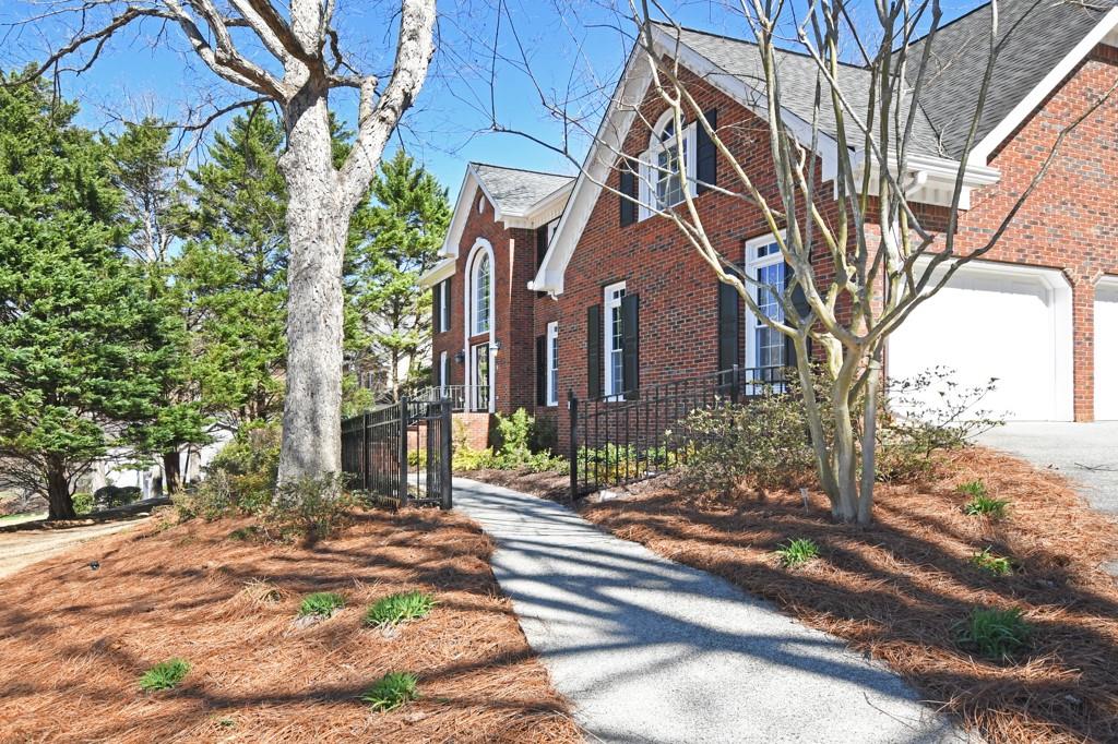 4409 Windsor Oaks Circle Marietta, GA 30066 - Photo 8 of 90 a building with trees in front of it