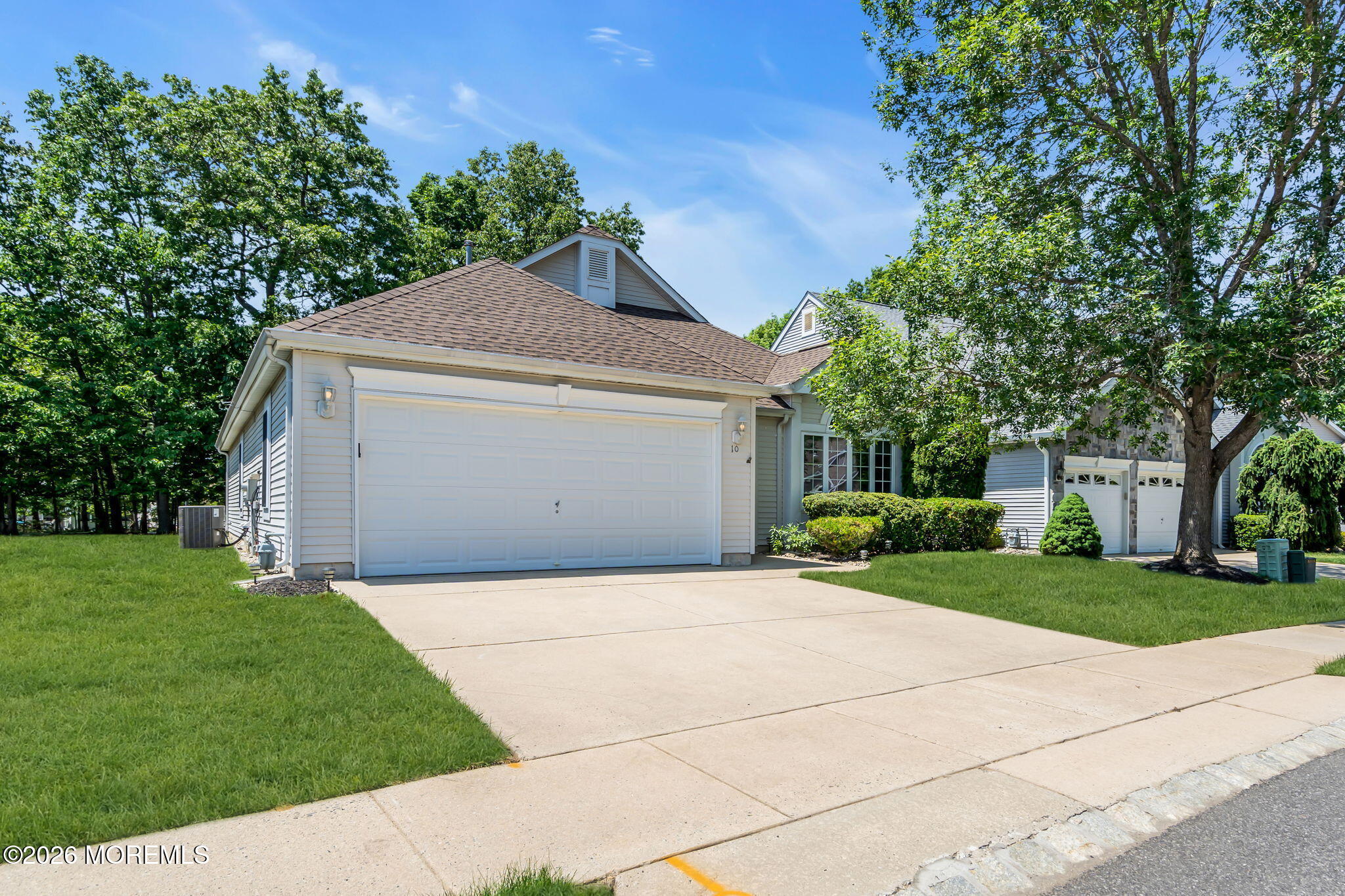 10 Congressional Road Jackson, NJ 08527 - Photo 68 of 72 a front view of a house with a yard and garage
