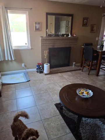 a living room with furniture and a rug