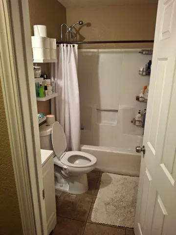 a bedroom with a bed and a closet