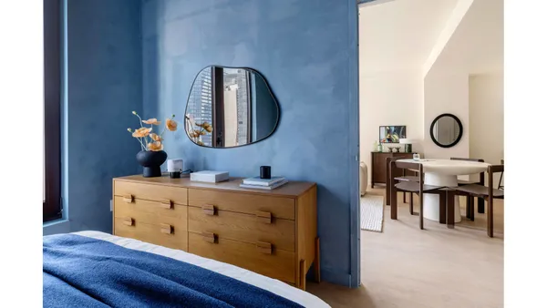 a view of a room with a table and chairs