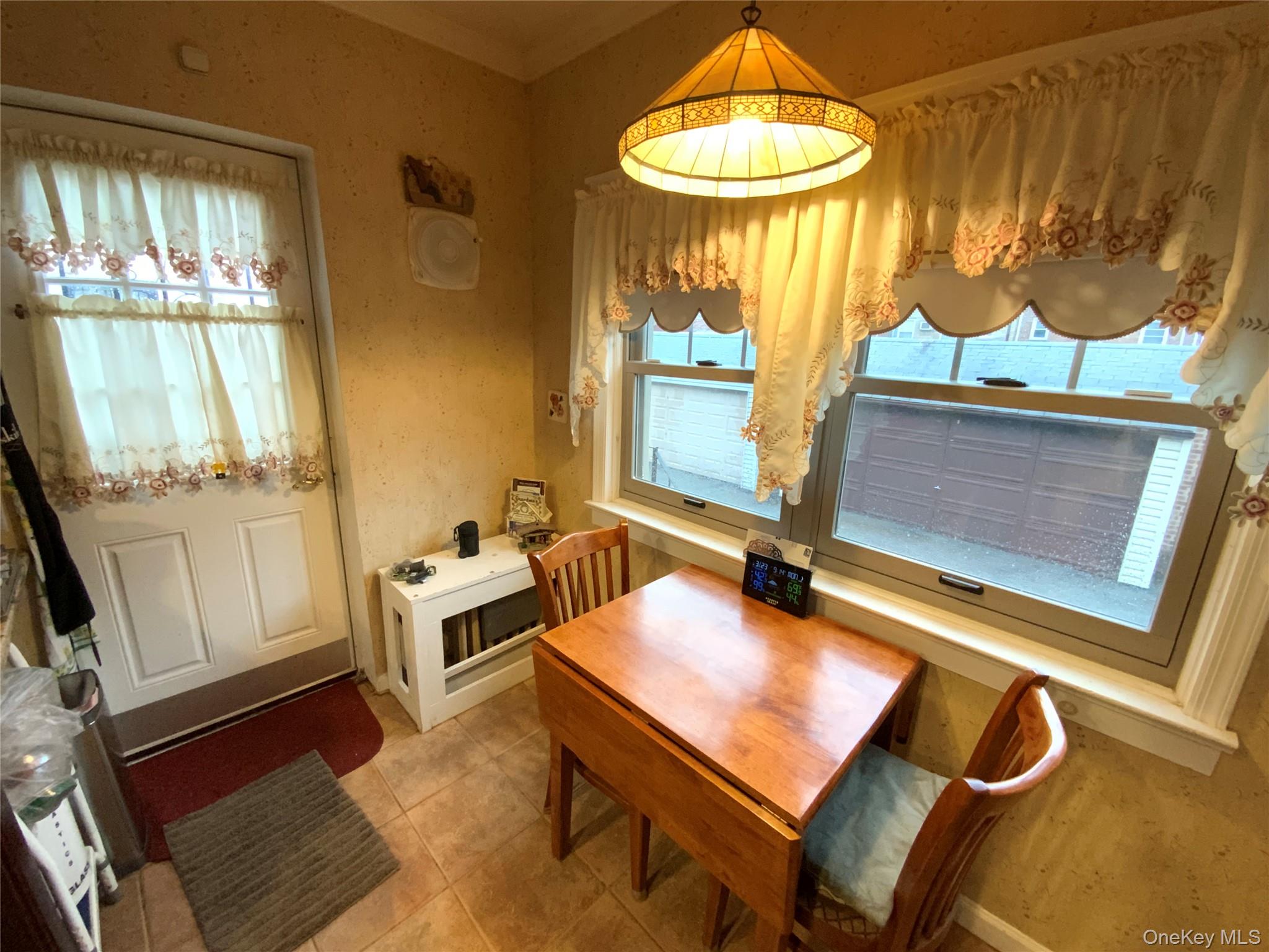 47-05 189th Street Queens, NY 11358 - Photo 14 of 41 a room with table and window