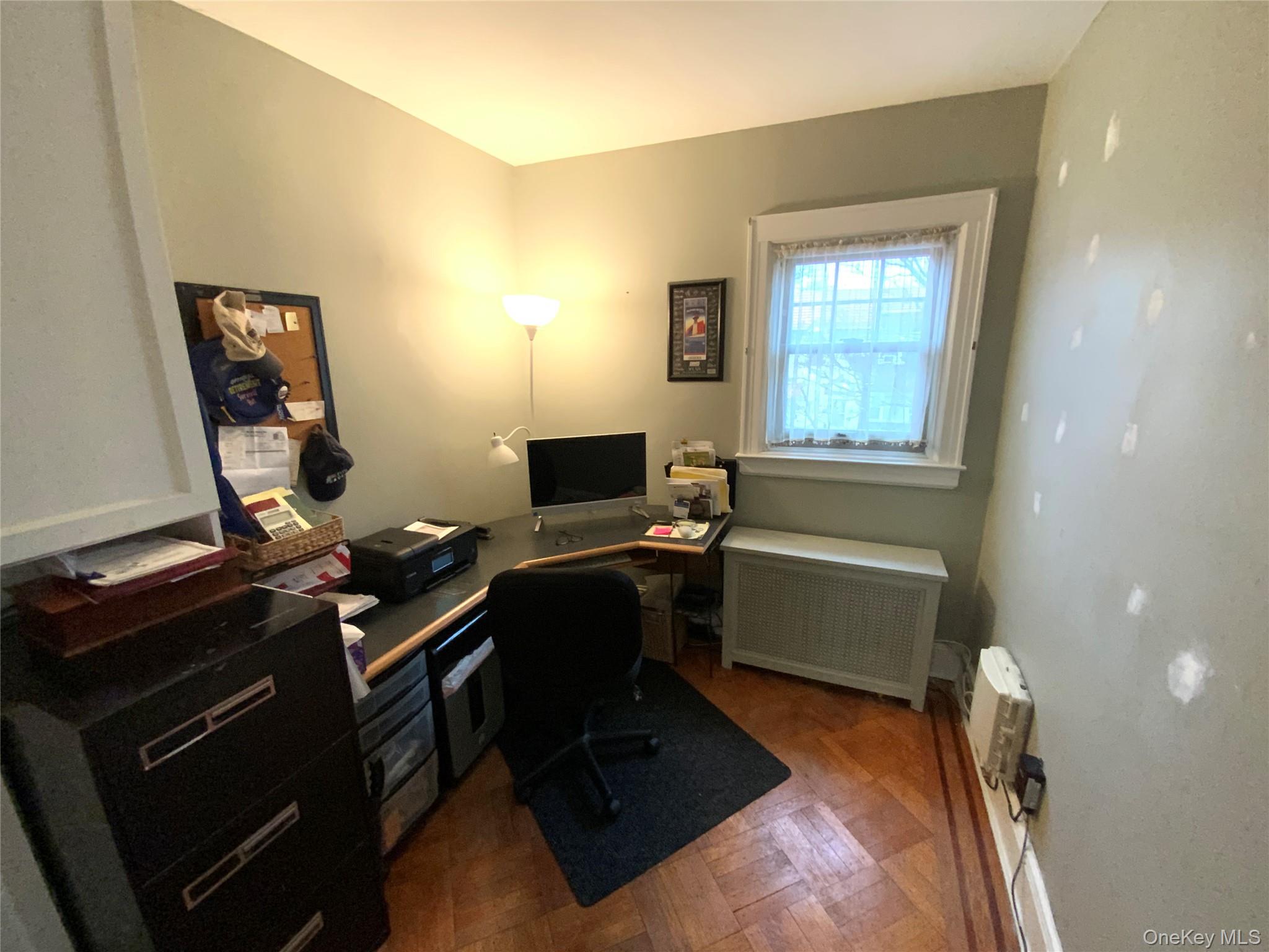 47-05 189th Street Queens, NY 11358 - Photo 17 of 41 a view of a workspace with furniture and a window