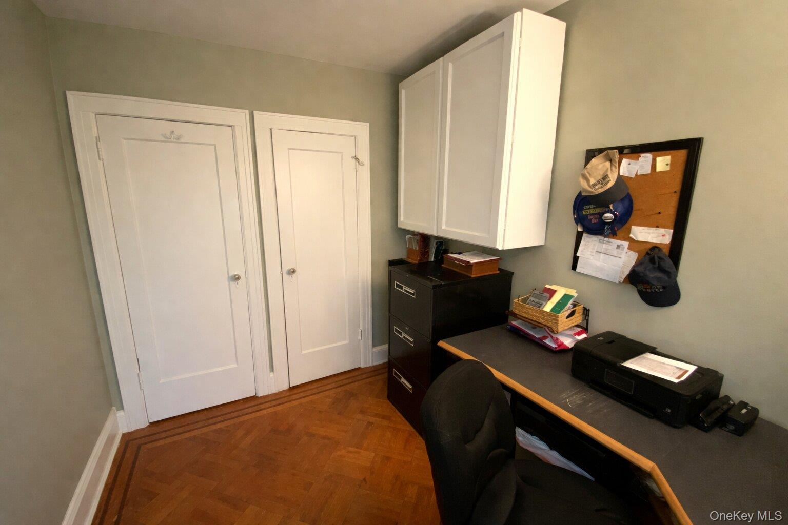 47-05 189th Street Queens, NY 11358 - Photo 18 of 41 a bedroom with a bed and cabinets