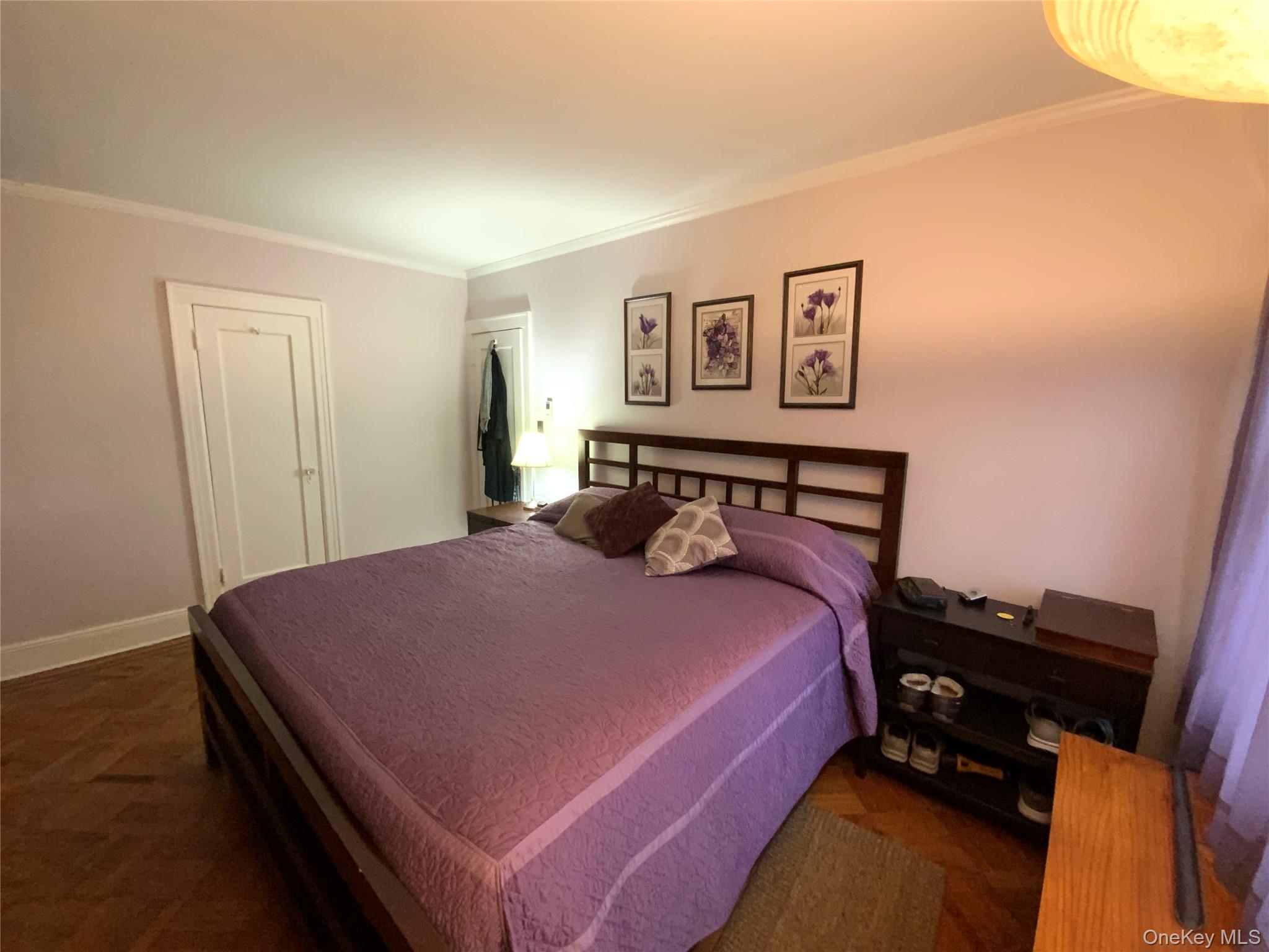 47-05 189th Street Queens, NY 11358 - Photo 25 of 41 a bedroom with a bed and wooden floor